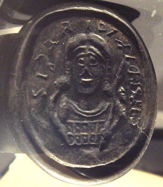 The signet ring of Childeric I, from the 5th century, depicting a centrally parted, long hair style. (Wikimedia)